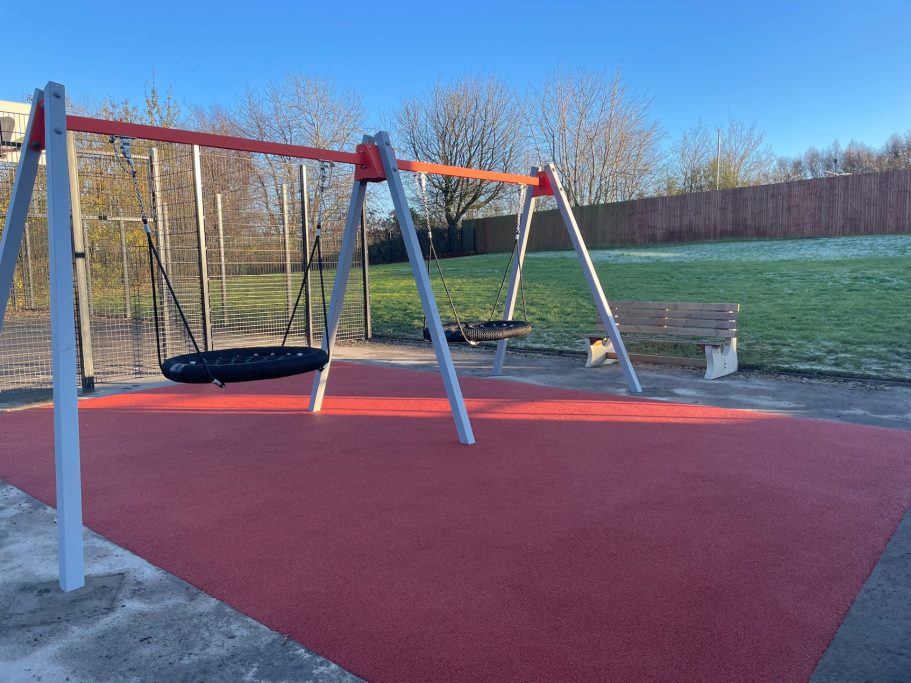Swing Set Area with Red Wet Pour Surface