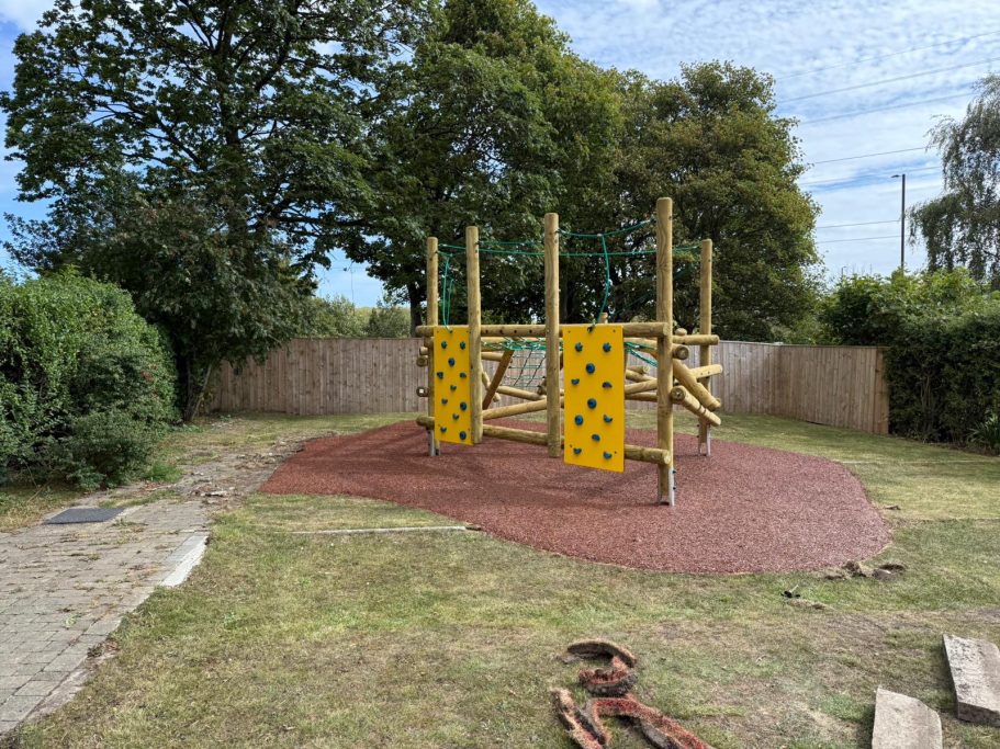 Timber Climbing Frame with Red Pour Surface